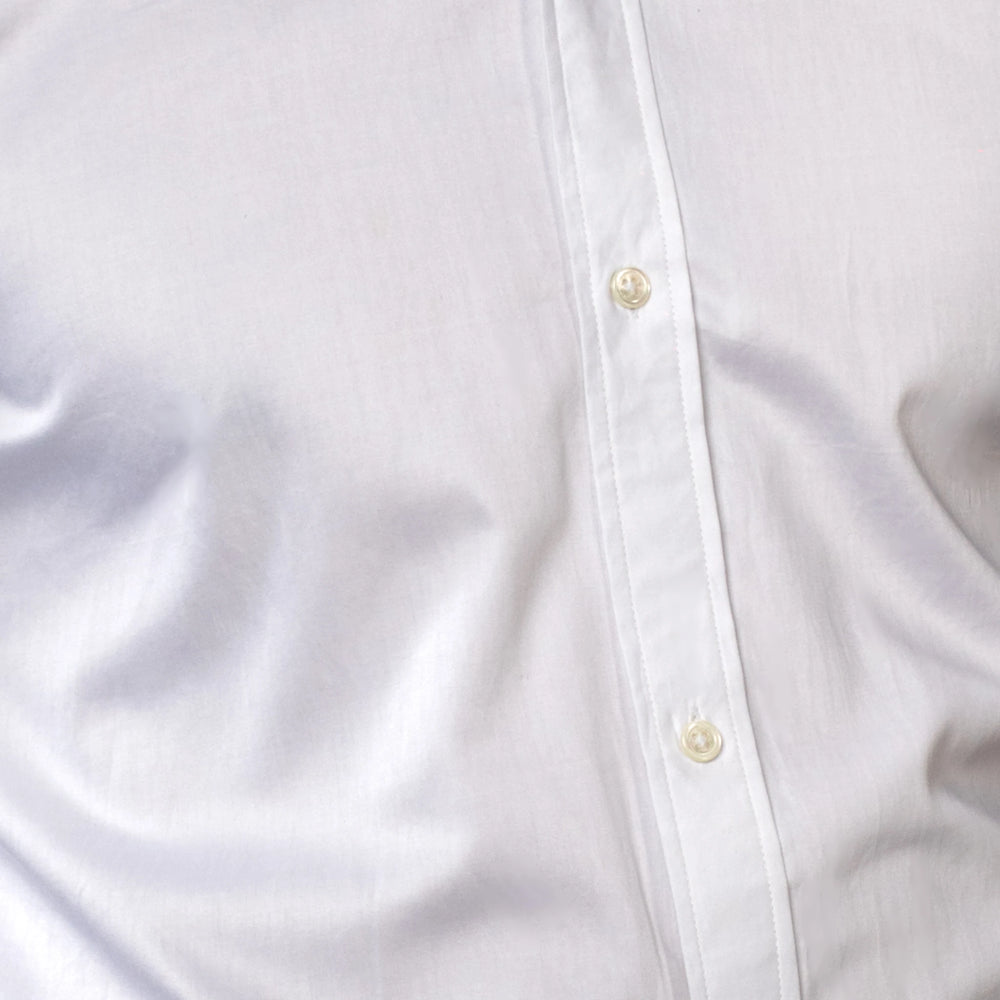 Close-up of a white shirt with button details brand appril