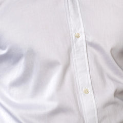 Close-up of a white shirt with button details brand appril
