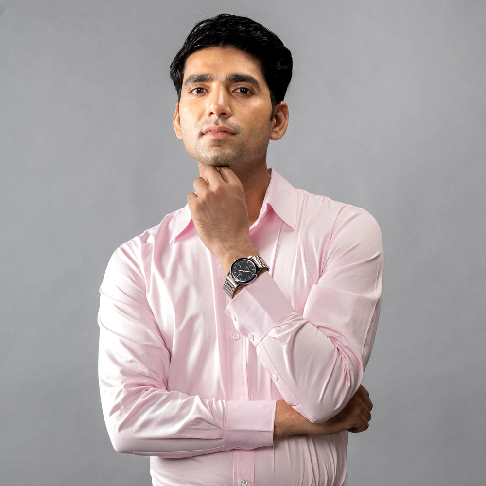 shirt is crafted from satin-finish Giza Cotton, and adorned with Trochus shell buttons