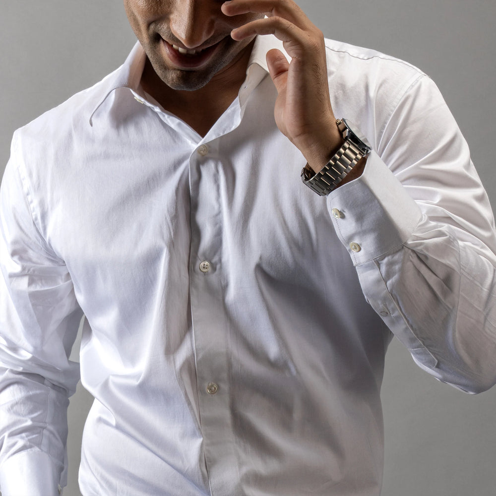 this crisp formal shirt, tailored from pristine Giza Cotton and embellished with Trochus shell buttons