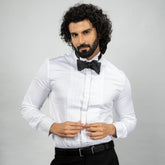 The Gala Tux redefines partywear with a wing collar, hidden placket, and French cuffs. Crafted from lustrous Giza Cotton and adorned with natural mother‑of‑pearl buttons and metal cufflinks,