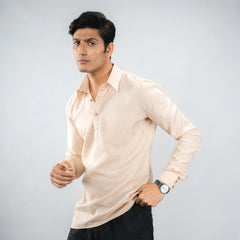 Man wearing a linen half‑placket beige shirt against a grey background