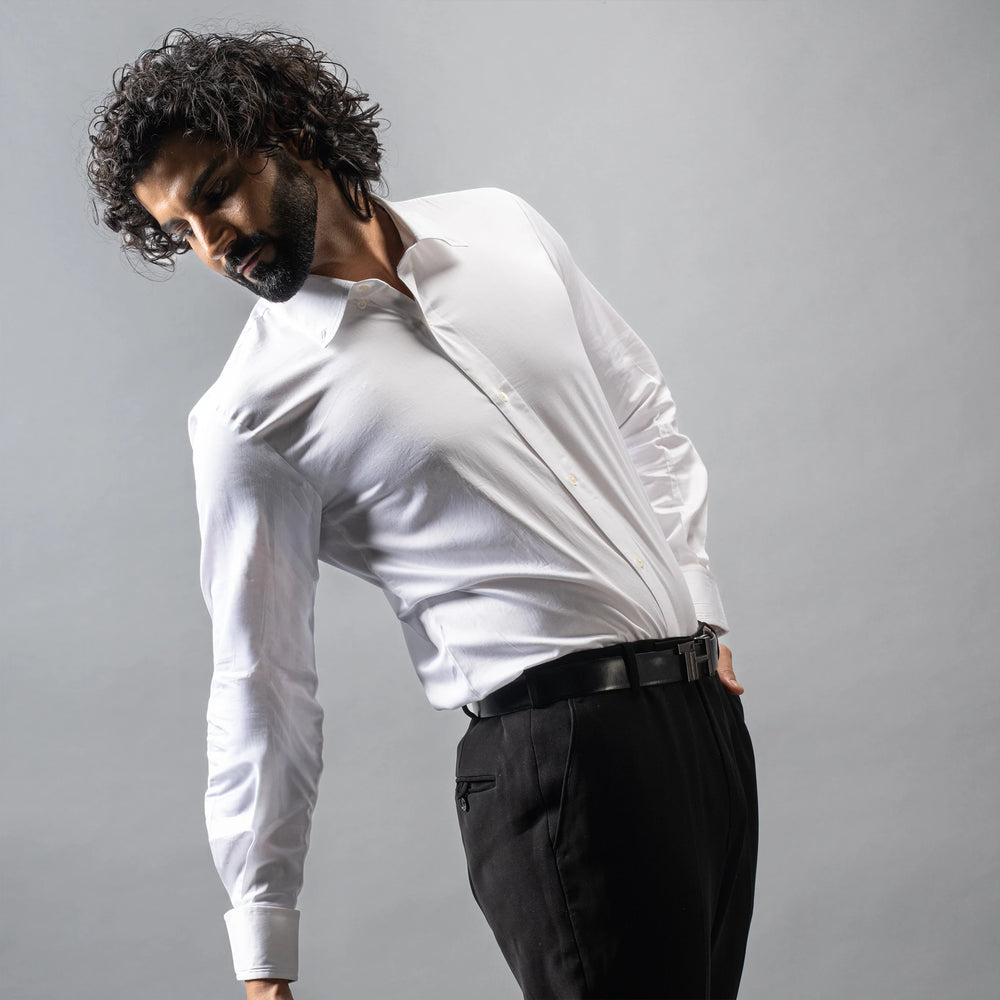 Your definitive formal shirt — button down collar and turnback cuffs, with box pleat back. Made from luxurious Giza Cotton, and finished with naturally marbled Trochus shell buttons, each shirt is a quiet expression of sophistication