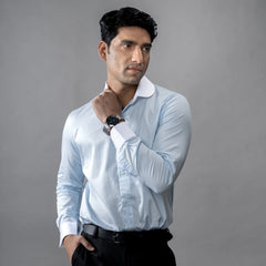 Man wearing brand appril formal wear light blue shirt a grey background