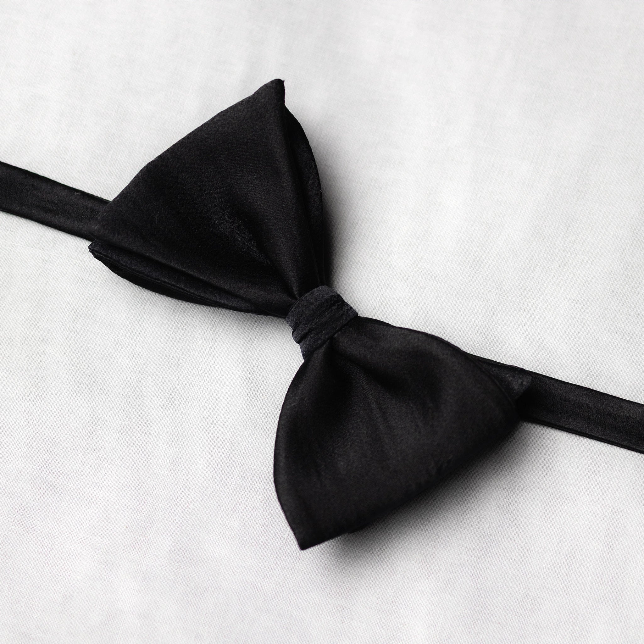 Black bow tie on a white background wide angle