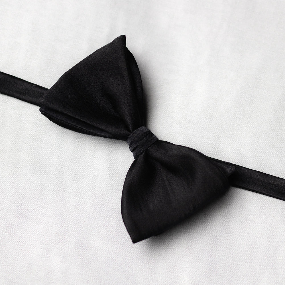 Black bow tie on a white background wide angle