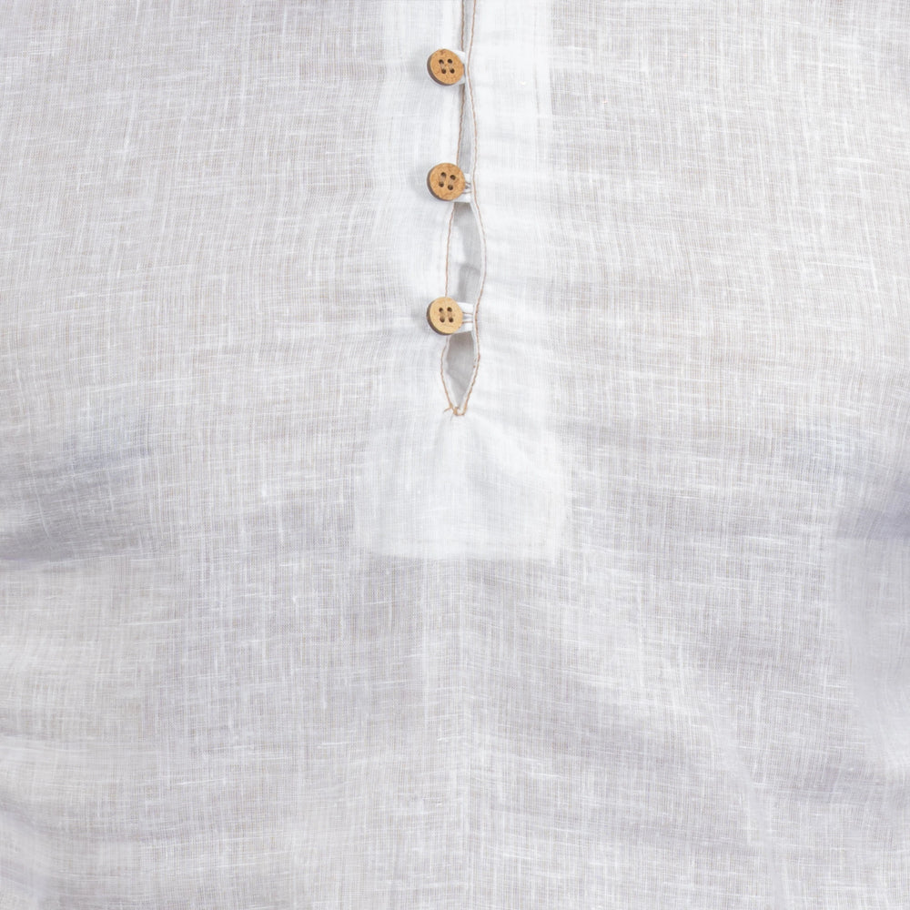 Close-up of a linen fabric with wooden buttons on a white background