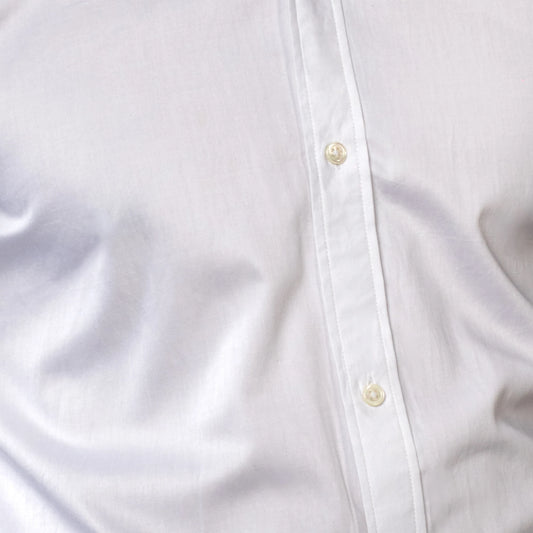 Close-up of a white shirt with button details brand appril