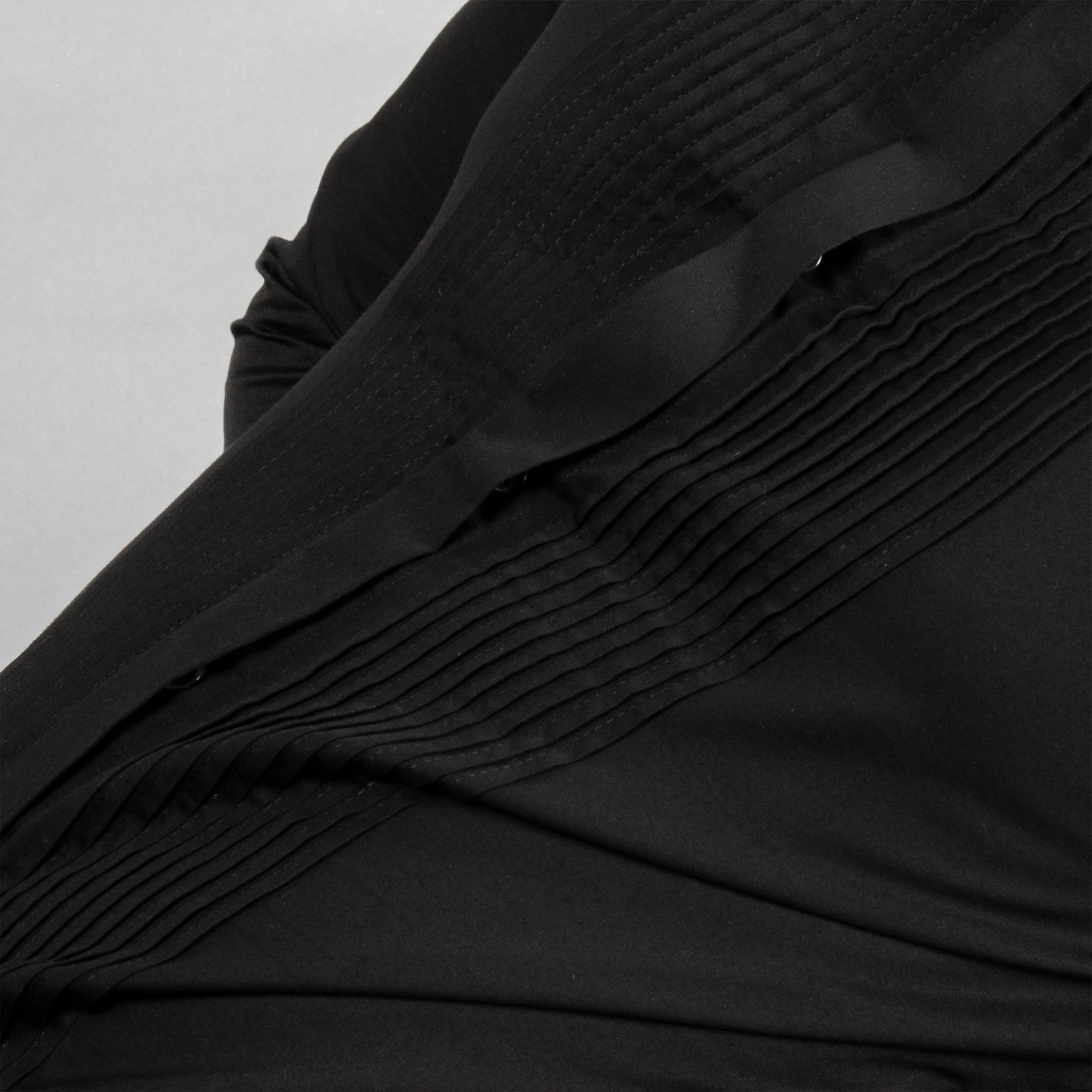 ustrous Giza Cotton and adorned with natural mother‑of‑pearl buttons 