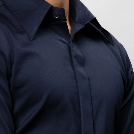 Navy blue shirt of brand appril on a plain background close up chest shot