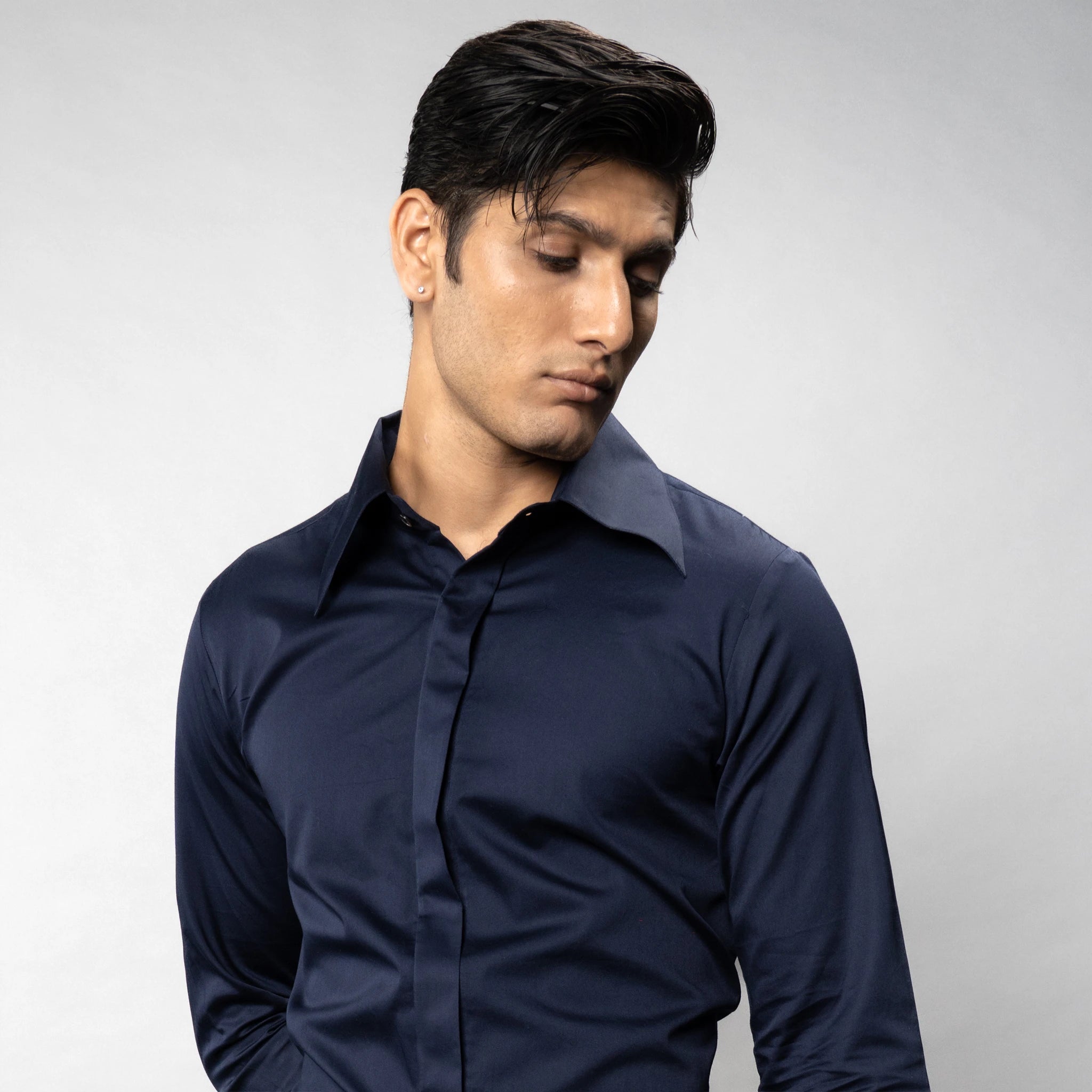man side posing  wearing a premium party wear shirt bof brand appril 
