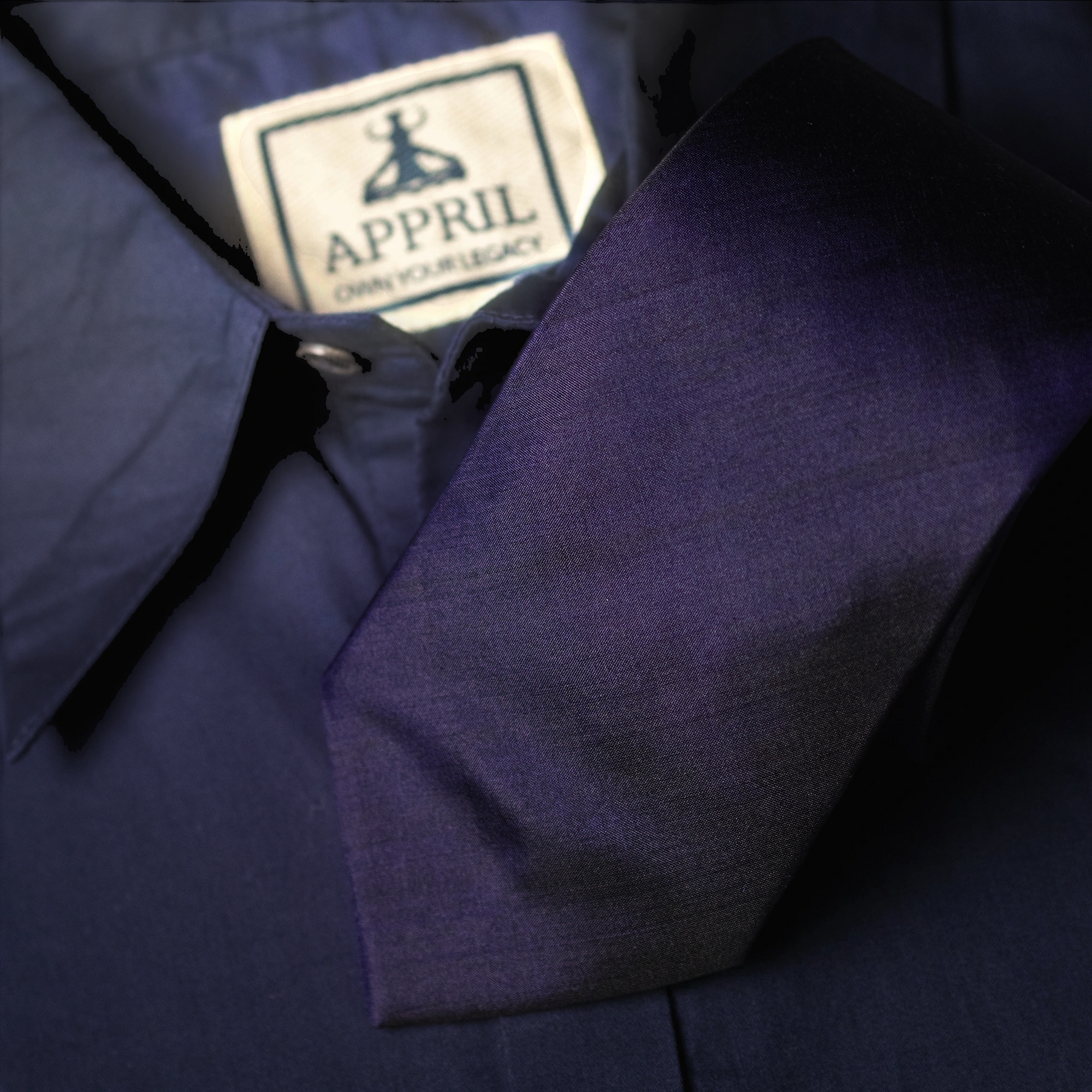 Navy blue Silk fabric Tie with a navy blue shirt in background