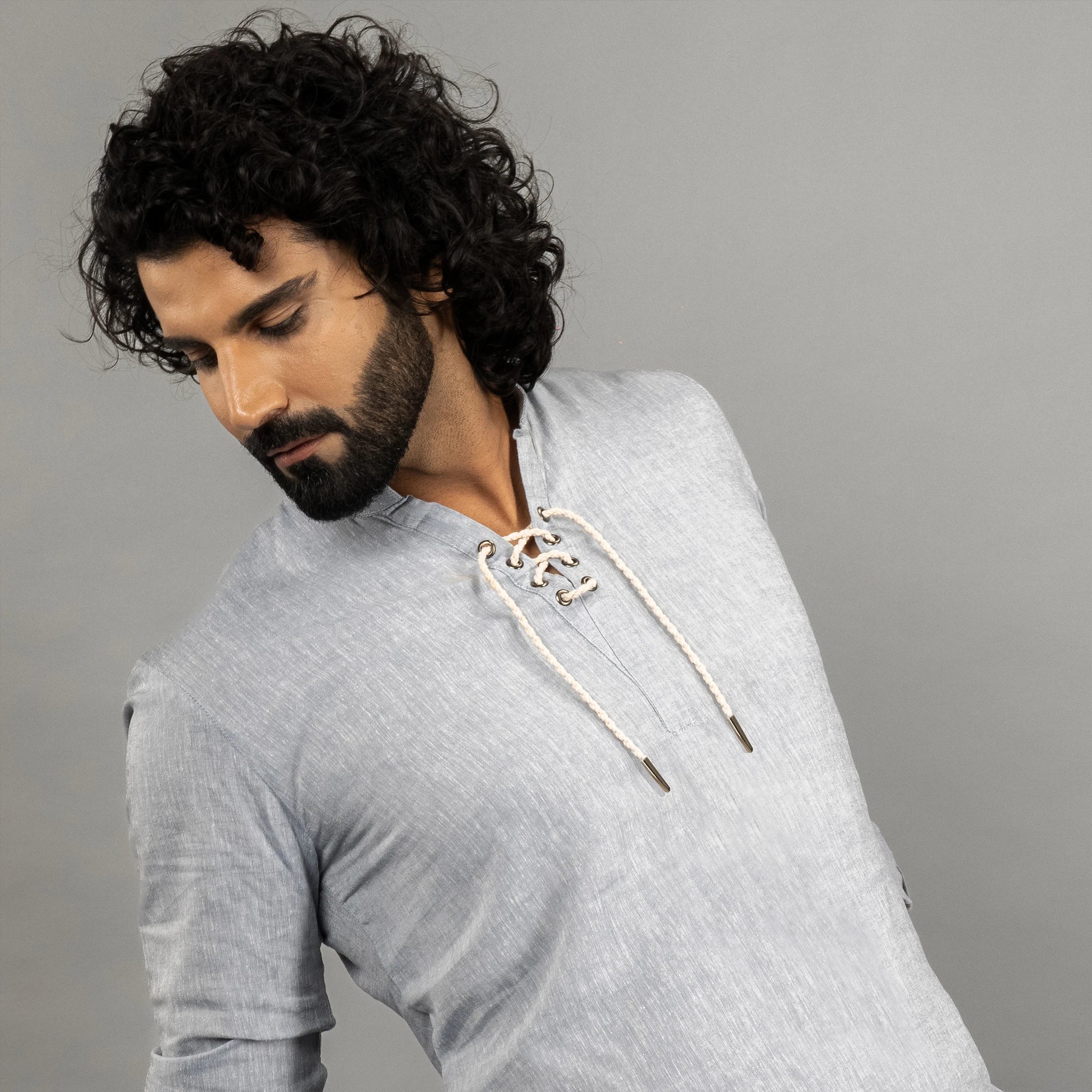 maritime‑inspired lace‑up linen shirt with roll‑up sleeves, metal eyelets