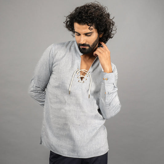 model posing wearing Nautica Faded Denim lace‑up linen shirt with roll‑up sleeves