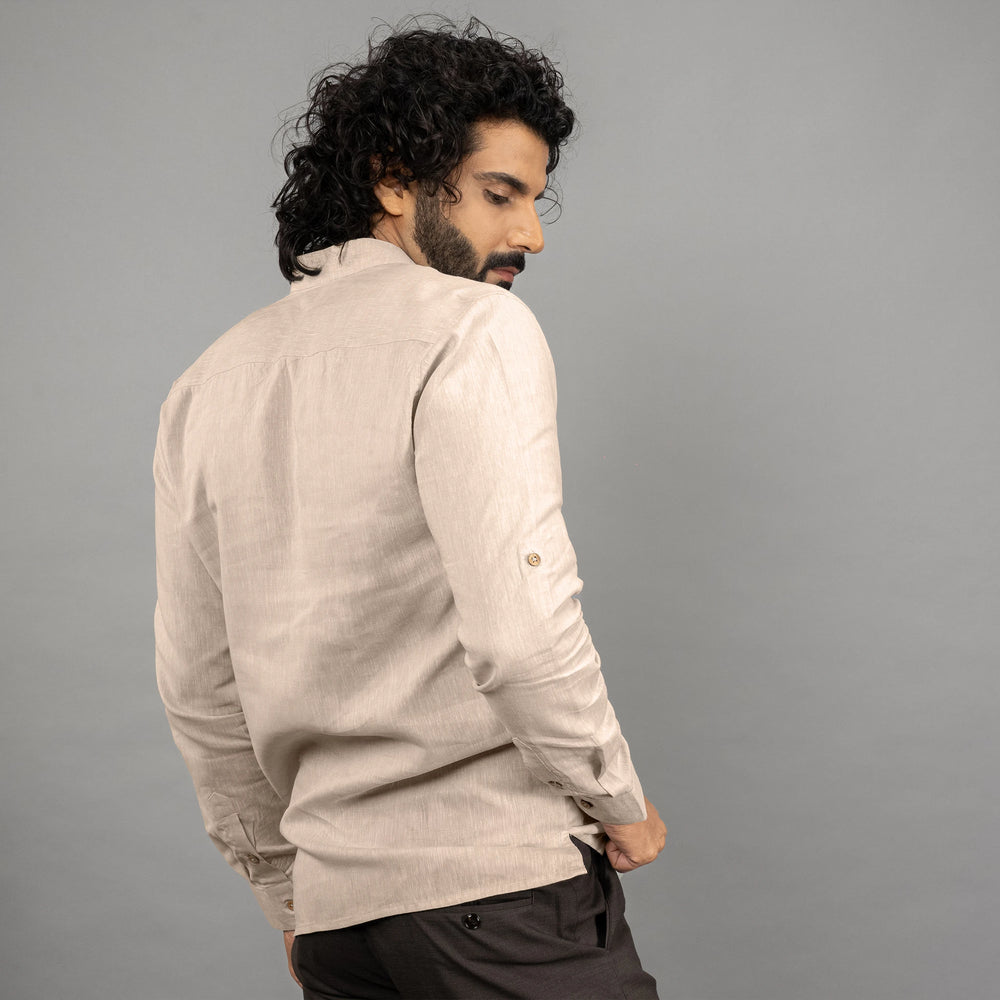 A maritime‑inspired lace‑up linen shirt with roll‑up sleeves posing backward