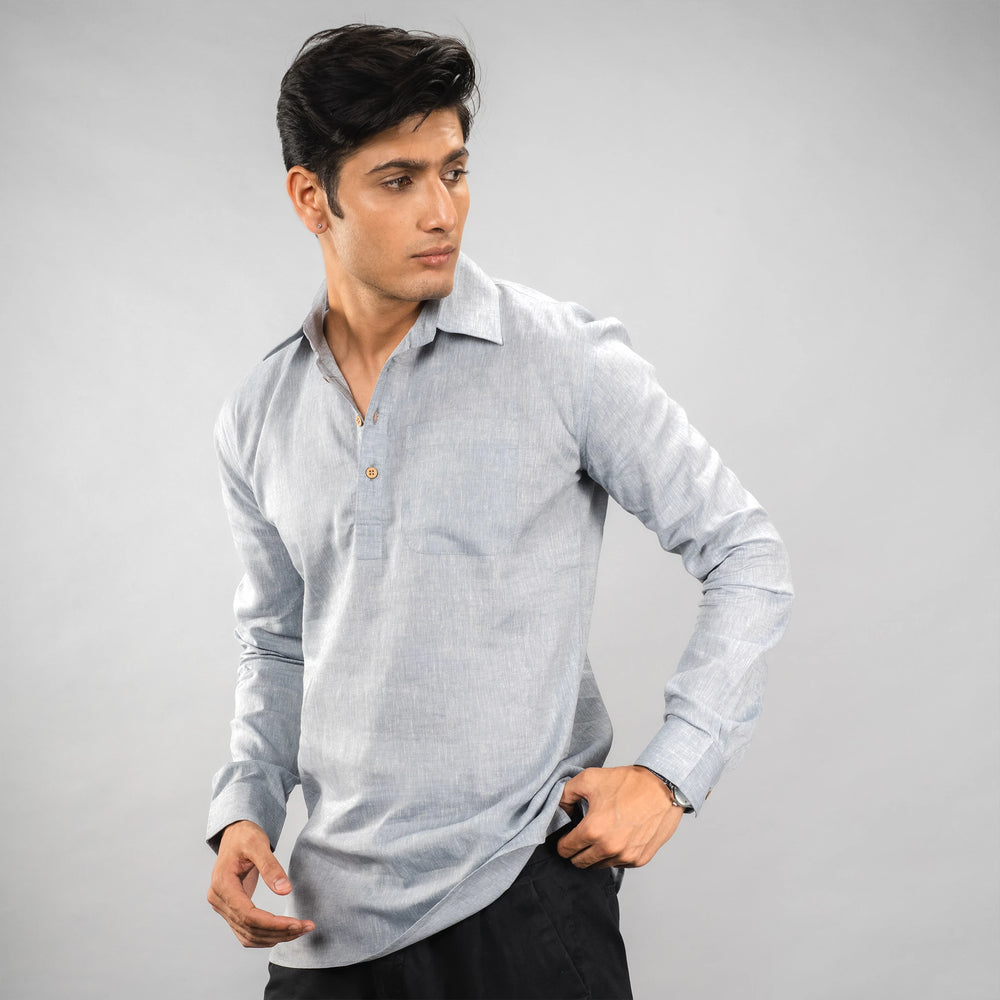 linen half‑placket shirt with coconut shell buttons and a relaxed fit