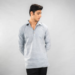 Man wearing a Faded Denim long-sleeve shirt against a plain background