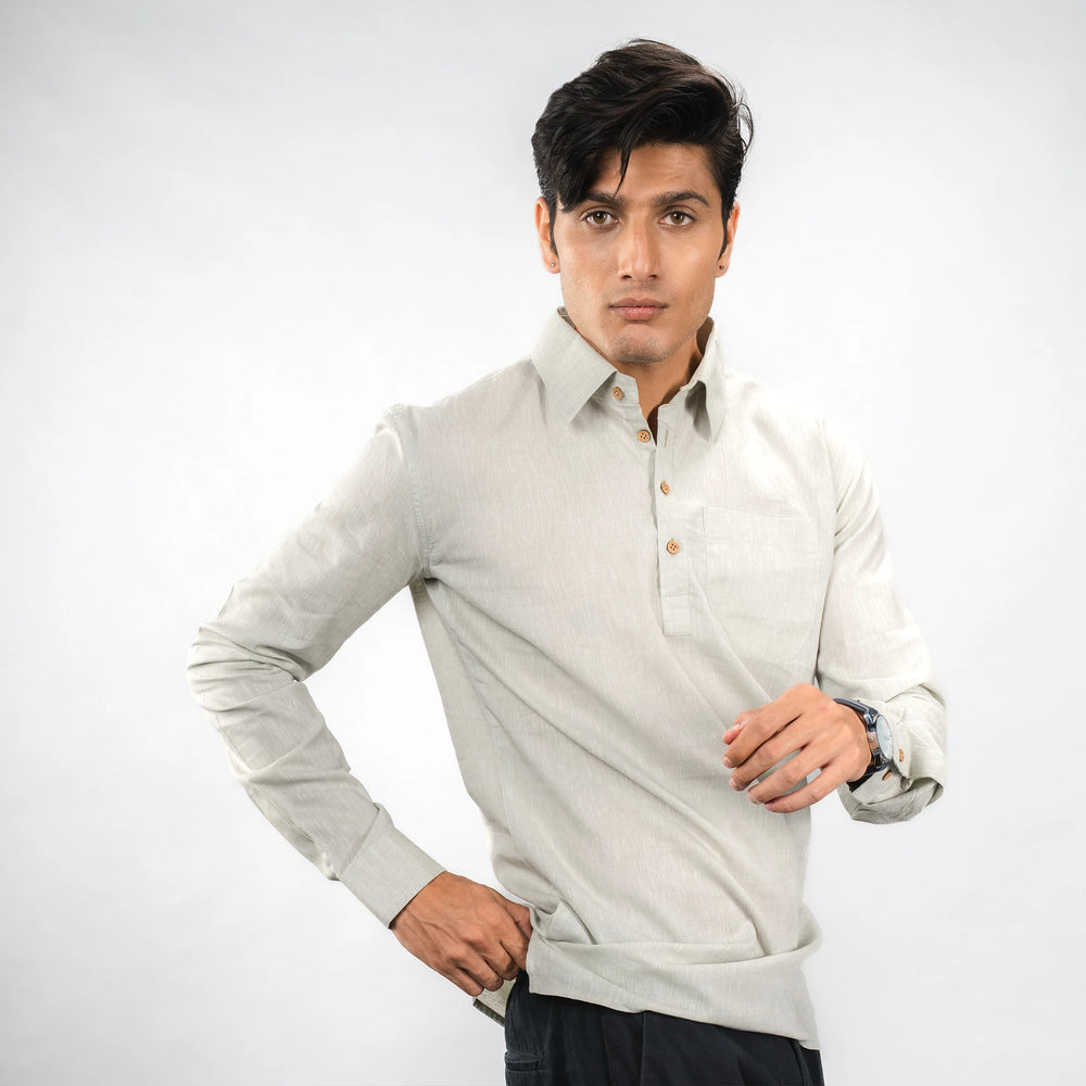 A casual‑luxury linen half‑placket shirt with coconut shell buttons and a relaxed fit