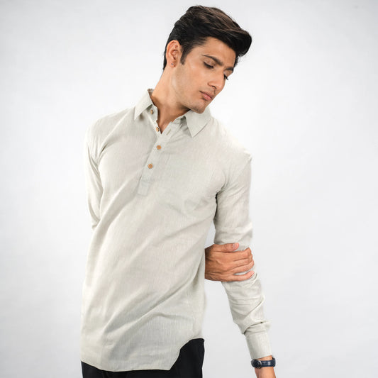 Man wearing a Oil Green long-sleeve shirt on a white background