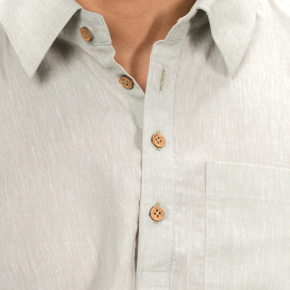 A casual‑luxury linen half‑placket shirt with coconut shell buttons