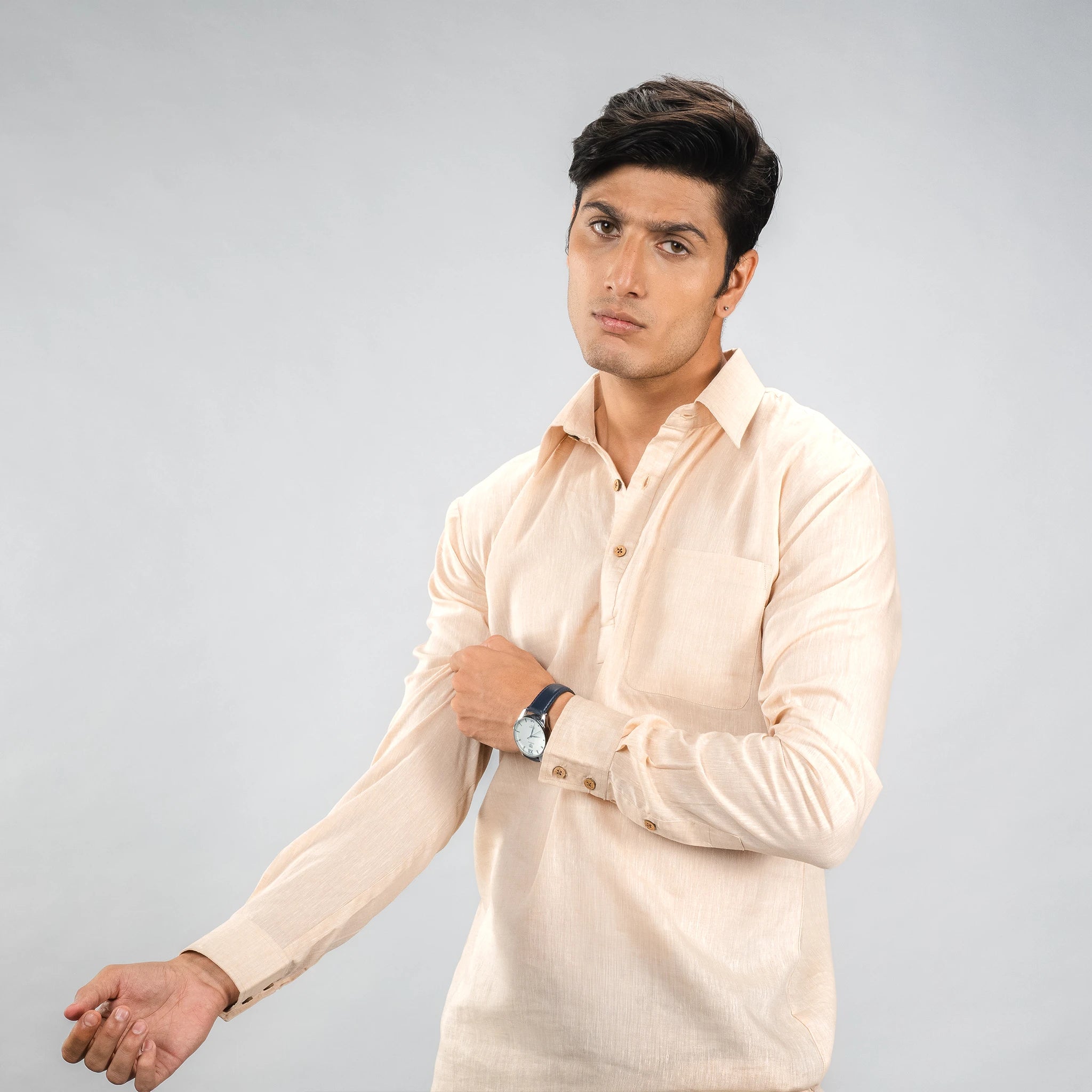 man posing casual‑luxury linen half‑placket shirt with coconut shell buttons 