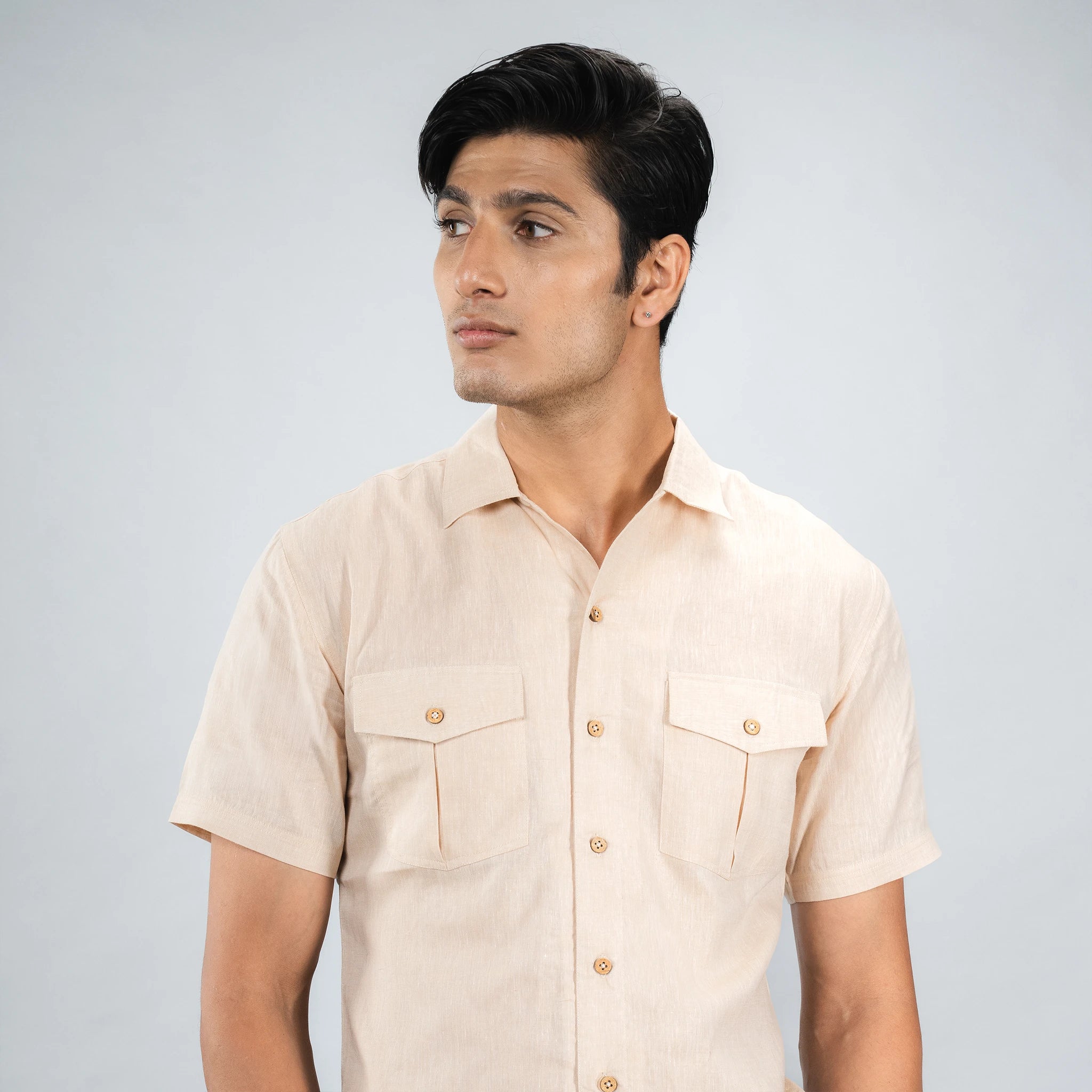 Man wearing a premium linen camp‑collar shirt  beige short-sleeve shirt