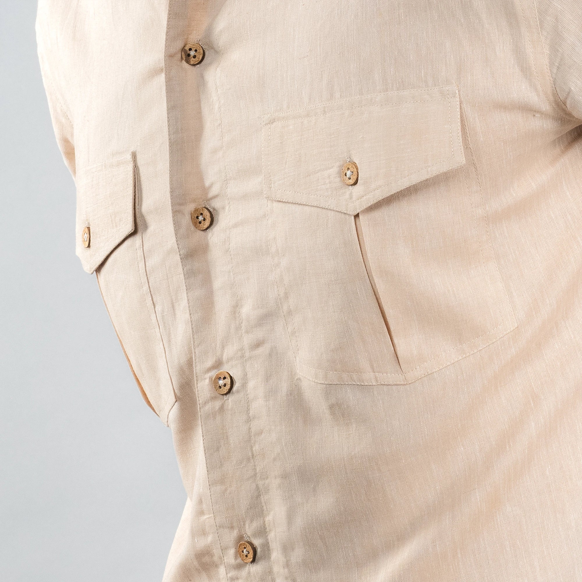 dual chest pockets finished with natural coconut shell buttons 